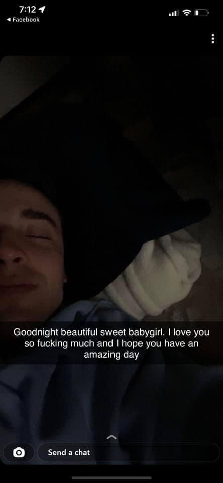 A young man with dark hair lies in bed with his eyes closed under a romantic text overlay.