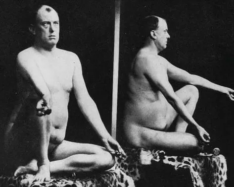 A vintage black-and-white studio photograph depicting front and profile views of a nude mature man seated on a leopard-print covered platform.